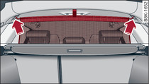 Behind the rear backrest: Hooking the load guard into place